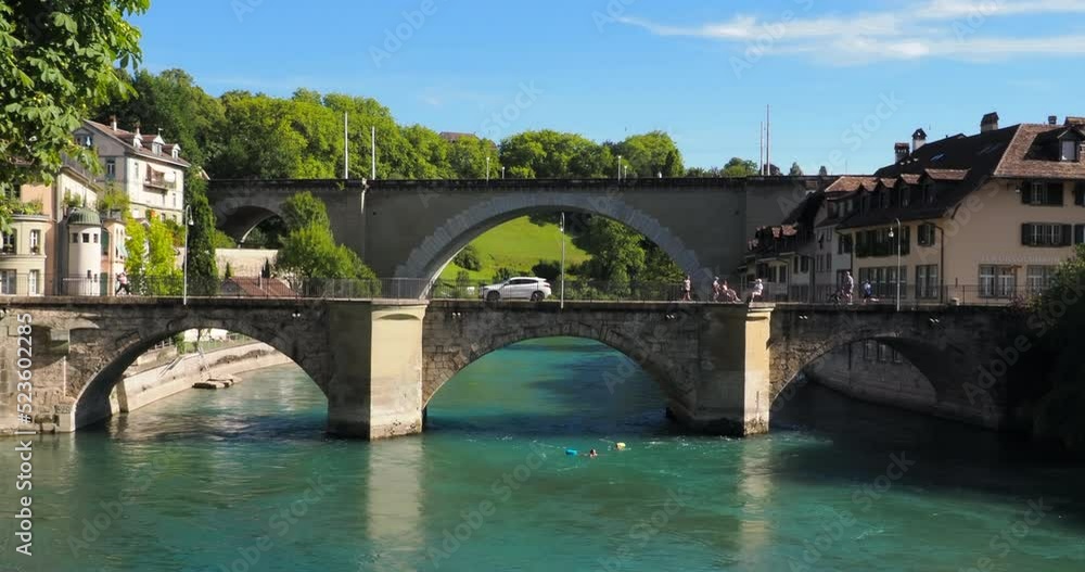 Bern, Switzerland - July 12, 2022: Historical old town of Bern with two bridges over the Aare river in summer Bern, Switzerland - July 12, 2022: Historical old town of Bern with two bridges over the Aare river in summer