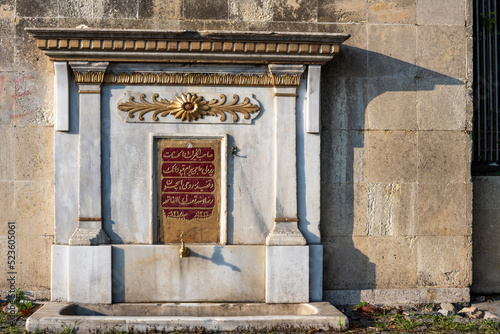 Istanbul,Turkey. 08 15 2022. Sariyer istinye district Istanbul old ancient public fountain established by ottoman empire period with magnificent engravings and painting called fountain. photo