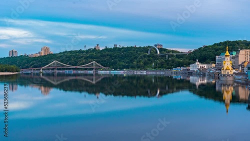 Kyiv/Ukraine, June 4, 2022. Timelapse of Cloudy sunset over Dnieper River from Havanskyi Bridge. Kyiv's Riverport. Ukraine photo