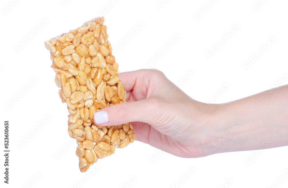 Fototapeta premium Kozinaki with peanuts in hand on white background isolation