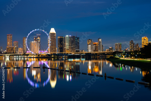 Singapore city skyline with modern skyscraper architecture building for concept of financial business and travel in Asia cityscape urban landmark, marina bay at night district dusk sky