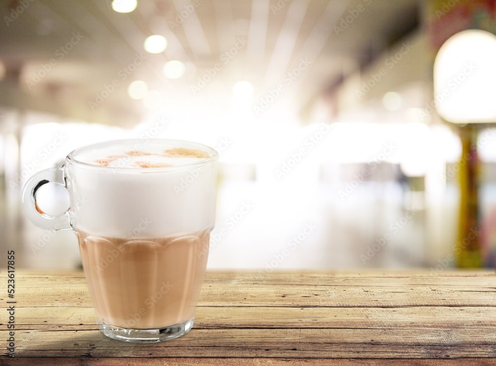 Tasty aroma coffee in a glass cup on the desk Tasty aroma coffee in a glass cup on the desk