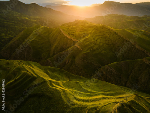 View of the green terraces and mountains at sunset. Summer landscape photo