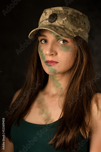 Woman warrior with camouflage makeup