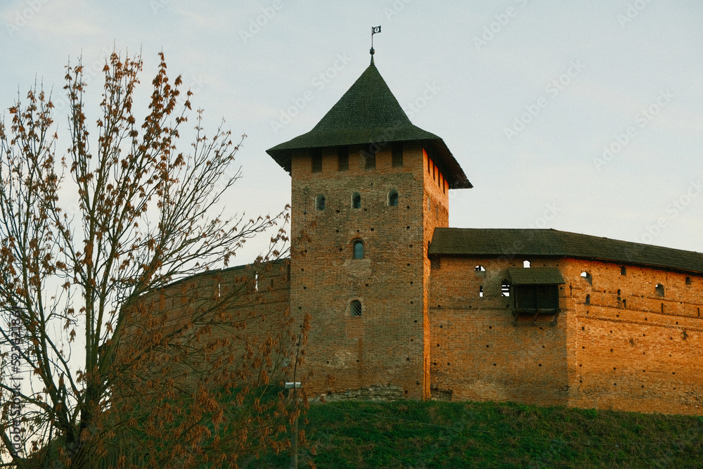 Walls and tower of an ancient castle. Brick walls and watchtower of an ancient castle. History - ancient Ukrainian castle