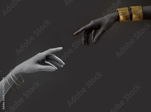 Black and white woman's hands with gold jewelry. Oriental Bracelets on a black painted hand. Gold Jewelry