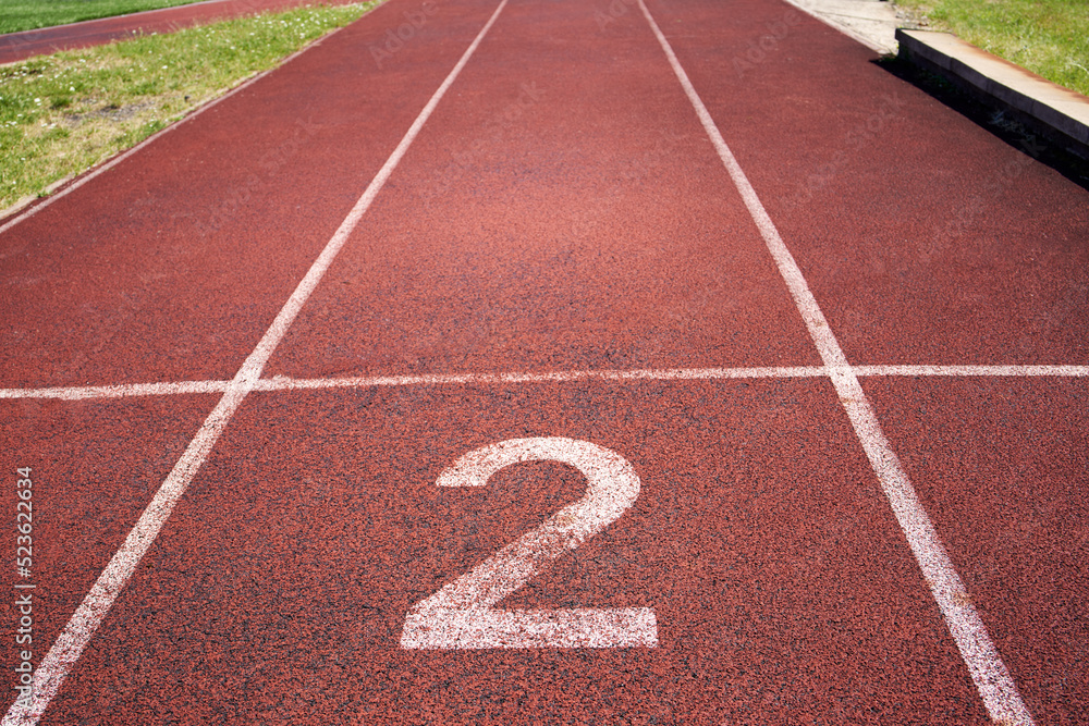 Clay running lane with number 2 written on it