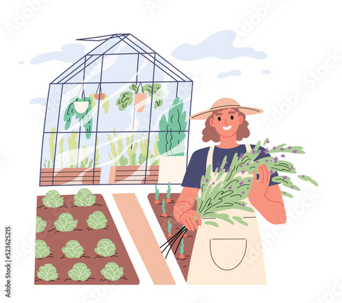 Woman gardener with her vegetable garden in background