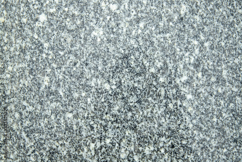 Background or texture of simple grey granite.