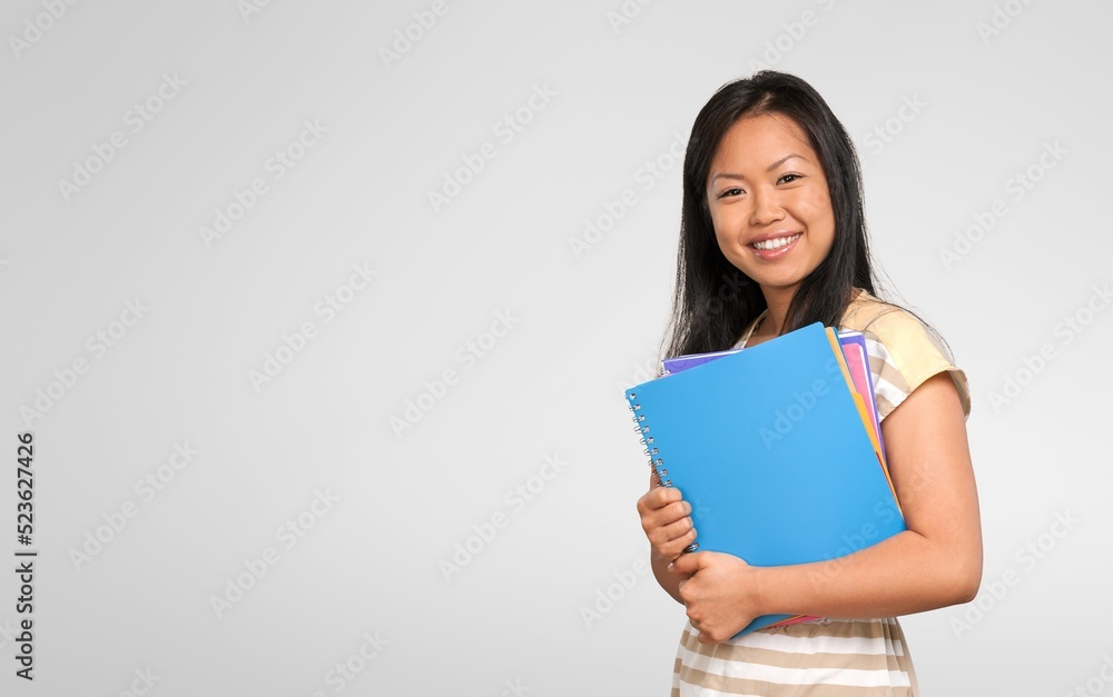 Happy high school student beautiful girl show a book Happy high school student beautiful girl show a book