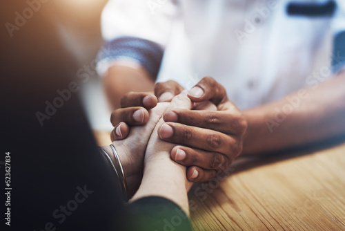 Canvas Print Interracial couple holding hands in support, comfort and trust while bonding and feeling united in home living room