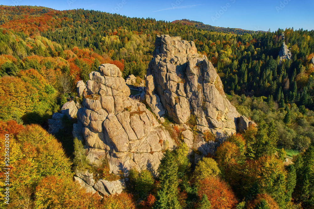 Aerial view from drone to Tustan fortress - archeological and natural monument of national significance in Urych village in autumn time, Ukraine.