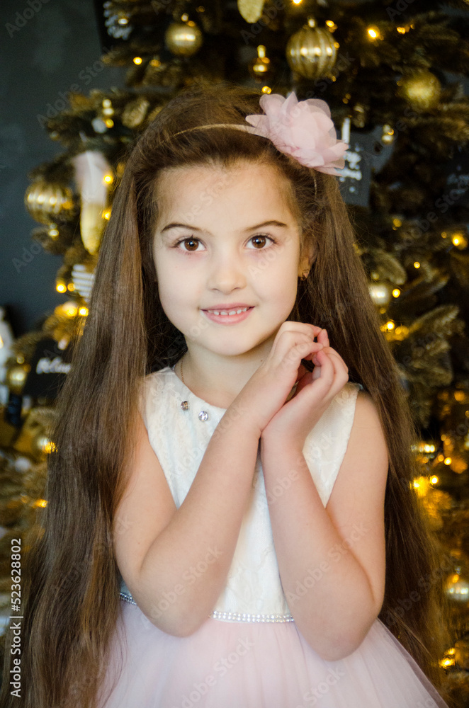 little brunette beautiful girl with present near fir tree on christmas little brunette beautiful girl with present near fir tree on christmas