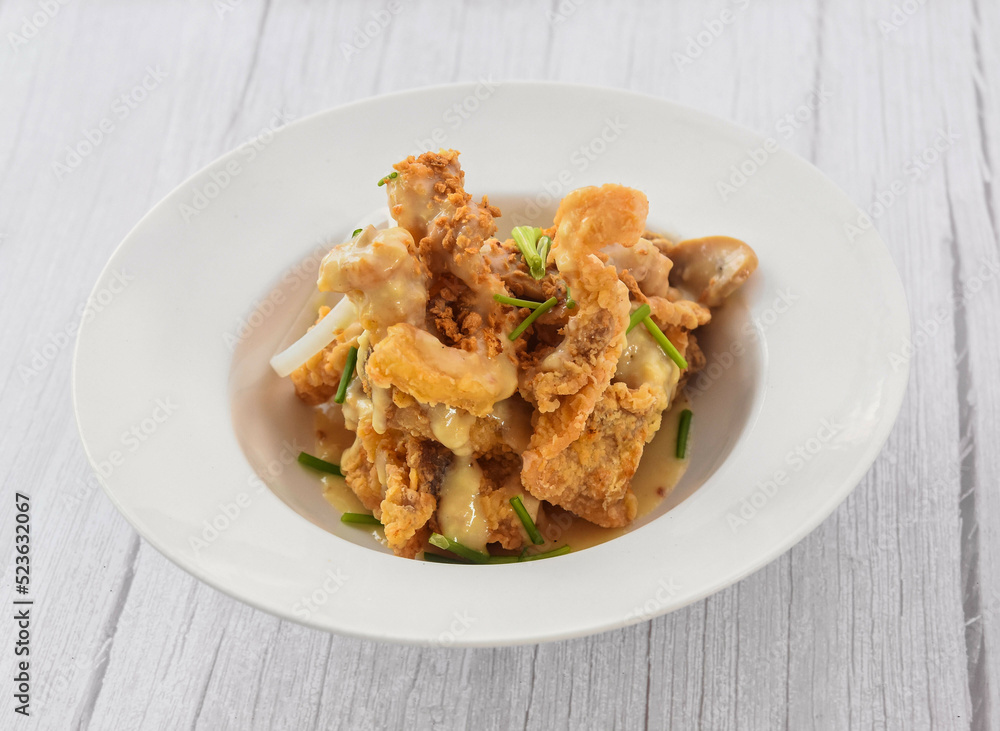 Pork Steak served in dish isolated on grey wooden background side view of fastfood Pork Steak served in dish isolated on grey wooden background side view of fastfood