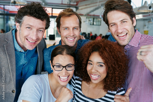 Принти на полотні Fun, cheerful and casual business people celebrating in an office together