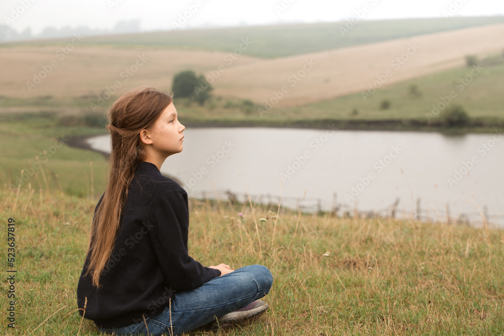 The girl is sitting in the water The girl is sitting in the water