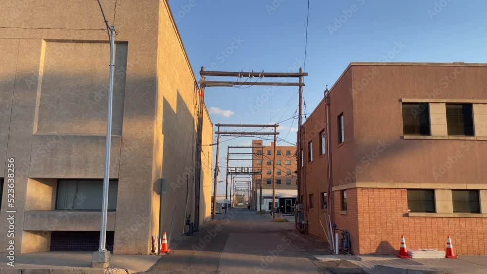 Interesting diminishing perspective vista at sunset in an alley in Roswell, New Mexico Interesting diminishing perspective vista at sunset in an alley in Roswell, New Mexico