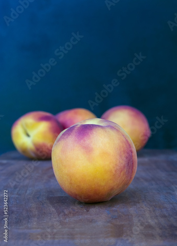 Peach on black background. Fresh sweet fruit closeup.