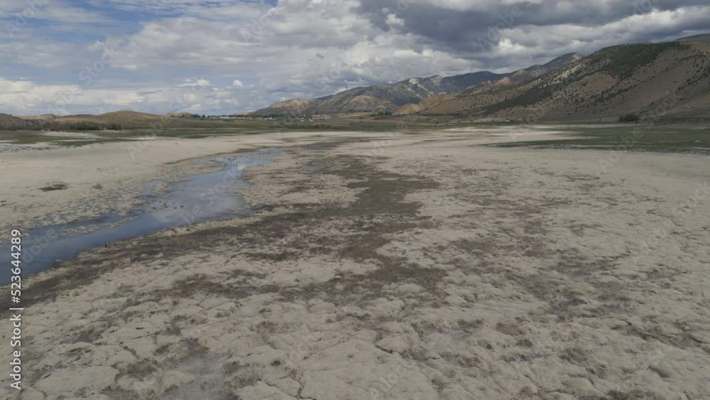 Aerial-Record drought reduces central Utah reservoir to a mere trickle from the former Sanpitch River with the remaining reservoir nothing but a dry lake bed. Aerial-Record drought reduces central Utah reservoir to a mere trickle from the former Sanpitch River with the remaining reservoir nothing but a dry lake bed.