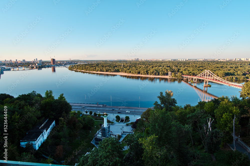 View of the Dnipro River and the Pedestrian Bridge in Kyiv, Ukraine.