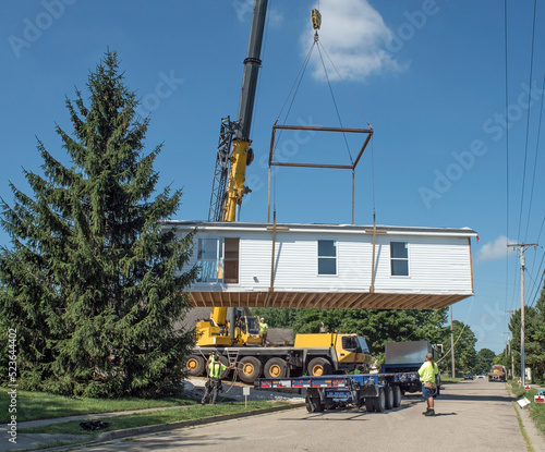 Tablou pe pânză Modular Home Lifted from Carrier Truck