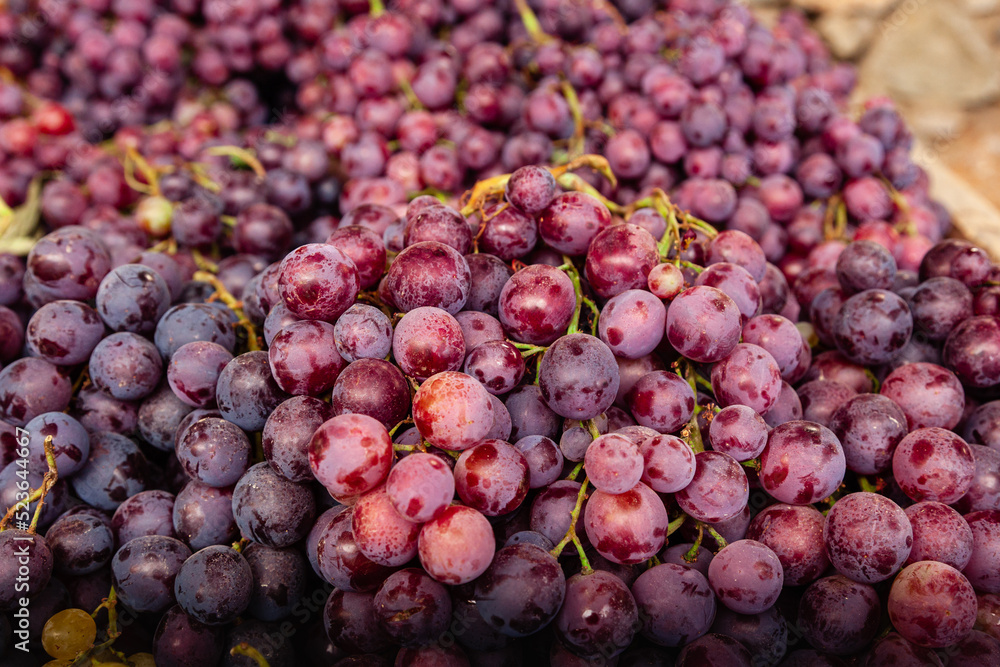 Selective focus of purple grapes group.  Purple grapes at a Farmer's Market. 