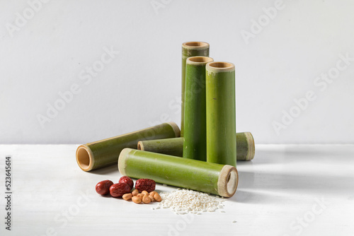 Bamboo tube and sticky rice on white background