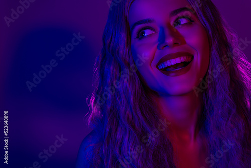 Majestic lady close up photo with beaming teeth look side have fun on theme masquerade isolated neon vivid background © Beauty Hero