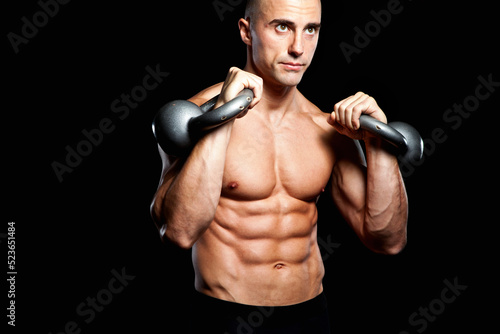 Fotografie Six pack with Kettlebells