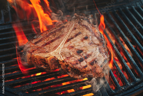 Canvastavla Barbecue dry aged wagyu porterhouse beef steak grilled as close-up on a charcoal