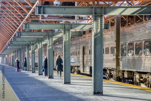 People wait for a the trains to allow boarding after work