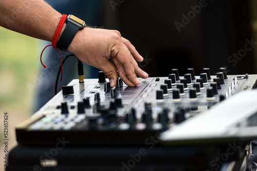 Hand on a mixer, operating the leader