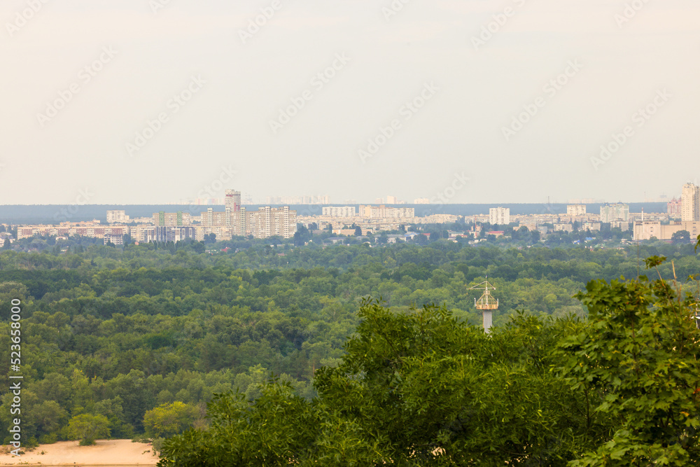 beautiful view of summer Kiev. Roofs of Podol and a view of the left bank