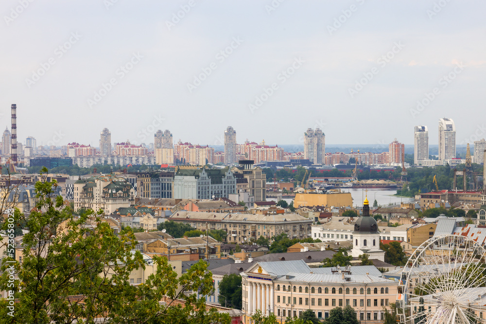 Fototapeta premium beautiful view of summer Kiev. Roofs of Podol and a view of the left bank