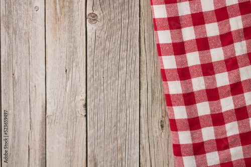 Wooden table and red and white checkered tablecloth, for picnic