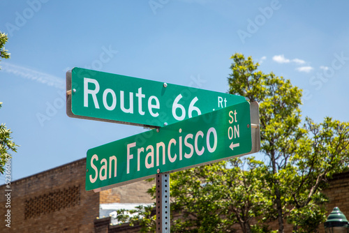 Photography street name Route 66 in typical green street plates in Flagstaff