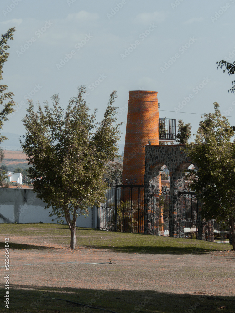 Park with brick mill and large trees Park with brick mill and large trees