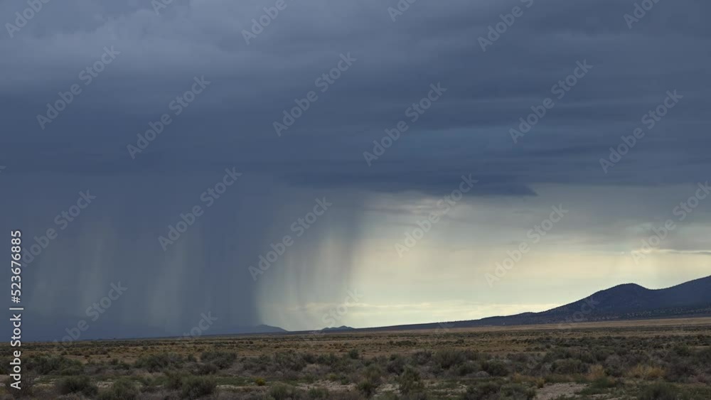 Lightning flashing as storm moves across the land and rain falls in the desert of Utah. Lightning flashing as storm moves across the land and rain falls in the desert of Utah.
