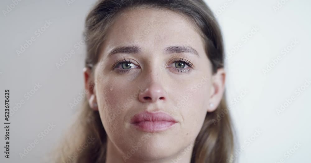 Depressed, crying and sad face of a woman looking alone and disappointed. Closeup of an emotional female suffering from PTSD and mental health issues, having a breakdown about bad news or a breakup Depressed, crying and sad face of a woman looking alone and disappointed. Closeup of an emotional female suffering from PTSD and mental health issues, having a breakdown about bad news or a breakup