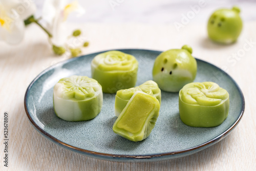 Traditional Chinese mid autumn festival dessert snowy skin rabbit shape mooncakes. The flavor is matcha green tea with pantan lotus paste