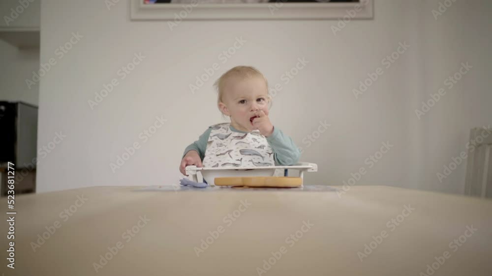 Lockdown Shot Of Cute Baby Boy Eating Apple On Table At Home - Jablonec nad Nisou, Czechia Lockdown Shot Of Cute Baby Boy Eating Apple On Table At Home - Jablonec nad Nisou, Czechia