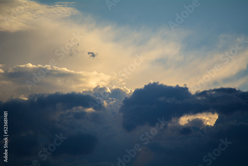 Beautiful Sunset with Clouds and Sun Rays with a Blue Sky Background