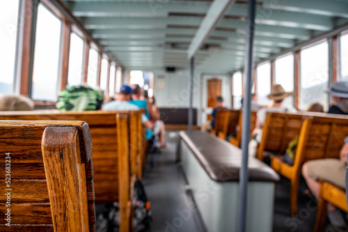 focus on wooden bench on a tour boat in Glacier National Park, Montana, USA photo