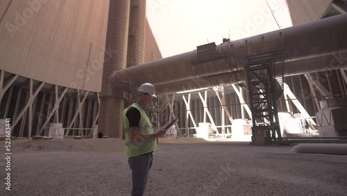 Power plant.
Engineer working on cooling tower.
