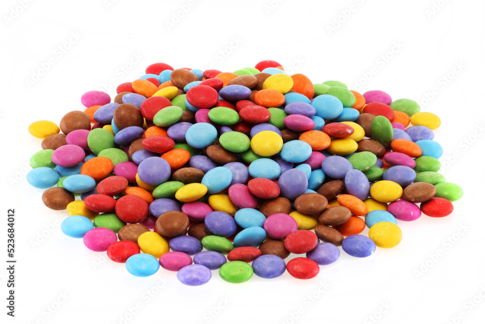 Heap of multi coloured halloween candy sweets on white Heap of multi coloured halloween candy sweets on white