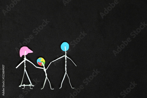 Autism Spectrum Disorder or ASD care, family acceptance and awareness concept. Couple stick figure holding hands with child with autism.