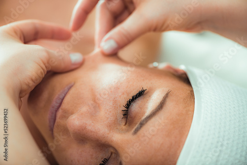 Photography Face lifting massage, beautiful woman getting face lifting massage in a beauty salon