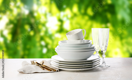 Set of clean dishes with cu...