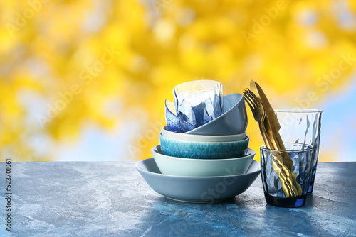 Set of clean dishes with cu...