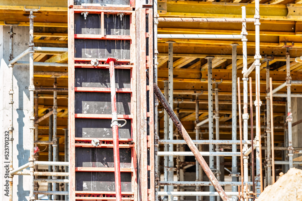 Formwork for pouring the second floor of a monolithic building. Reinforcement of walls and ceiling. Monolithic work during the construction of a building close-up. Construction technologies. Formwork for pouring the second floor of a monolithic building. Reinforcement of walls and ceiling. Monolithic work during the construction of a building close-up. Construction technologies.